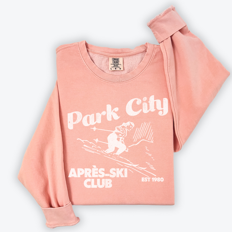 Park City Après Ski Club Comfort Colors lightweight crewneck sweatshirt featuring a female skier design with vintage retro grunge vibes, ideal for ski trips and winter getaways.