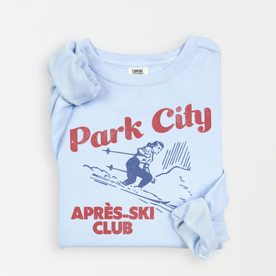 Park City Après Ski Club Comfort Colors lightweight crewneck sweatshirt featuring a female skier design with vintage retro grunge vibes, ideal for ski trips and winter getaways.