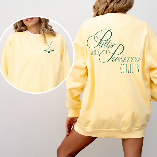 Unisex Comfort Colors sweatshirt with “Puts and Prosecco Club” in vintage style print on the back and crossed golf clubs on the front pocket