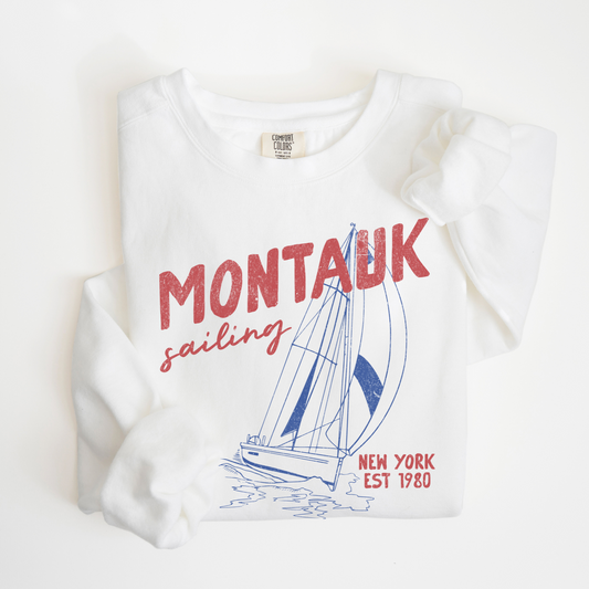 Montauk Sailing lightweight crewneck sweatshirt with a vintage retro design and faded grunge look, inspired by the sailing culture of Montauk's coastal heritage.