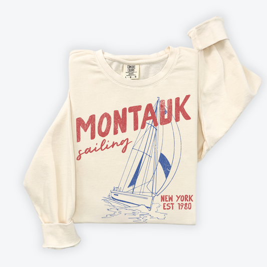Montauk Sailing lightweight crewneck sweatshirt with a vintage retro design and faded grunge look, inspired by the sailing culture of Montauk's coastal heritage.