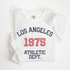 os Angeles Athletic Department lightweight cotton crewneck sweatshirt with a retro, faded athletic design in a vintage style, made from soft cotton.