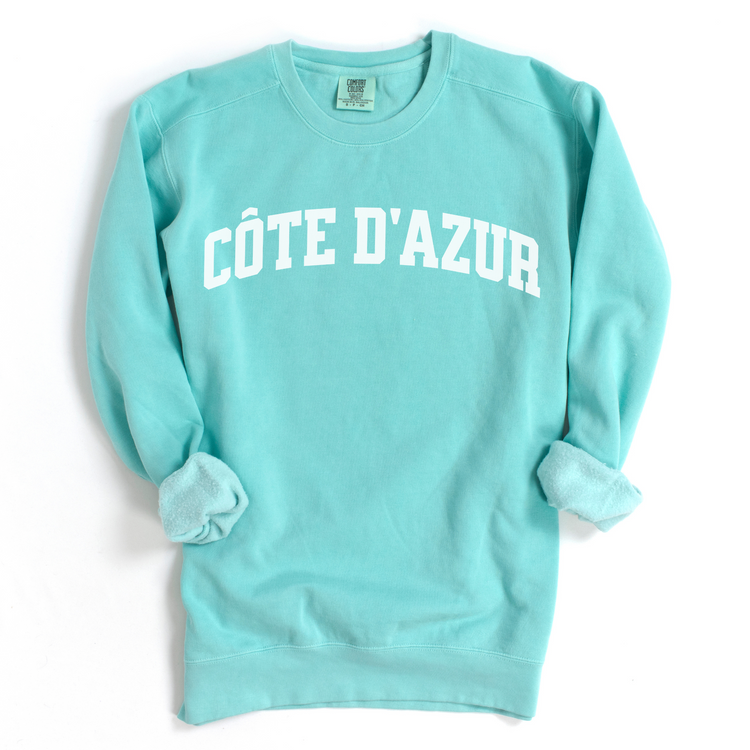 Côte d'Azur Comfort Colors lightweight cotton crewneck sweatshirt in a simple, sporty university font, perfect for travel days with a relaxed and comfortable fit.