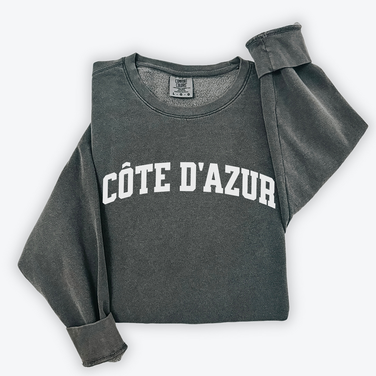 Côte d'Azur Comfort Colors lightweight cotton crewneck sweatshirt in a simple, sporty university font, perfect for travel days with a relaxed and comfortable fit.